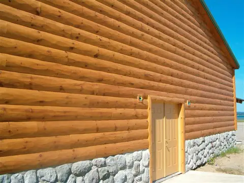 3x10 FatBoy log siding with a hand-hewn face